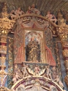 The Blessed Mother above in the Sanctuary.