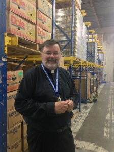 Fr. Bud explains how much food comes in to be organized and prepared.