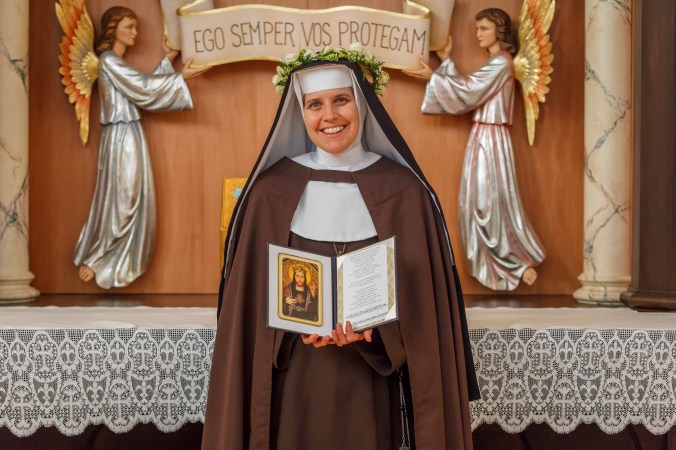 sr-john-mark-holding-a-book